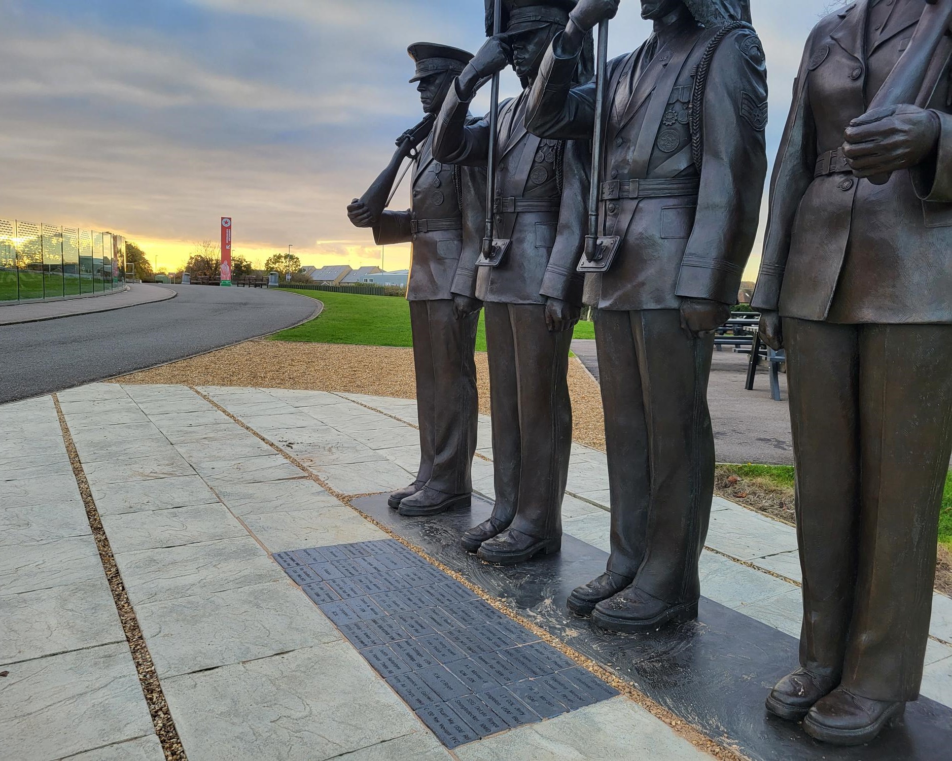 Bricks lay in front of the Honor Guard at the American Air Museum in Britain