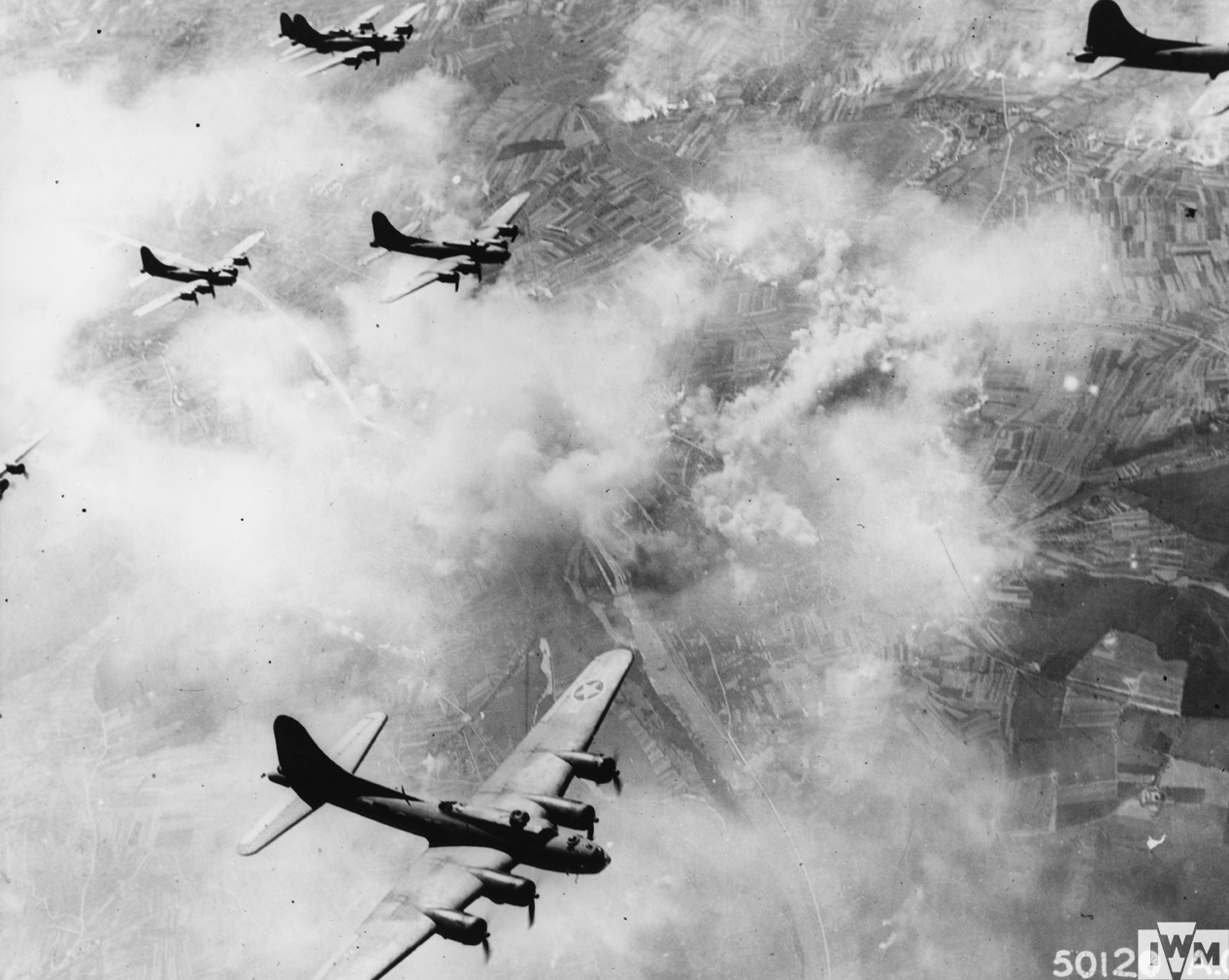 A burning Messerschmitt Bf 109 aircraft factory in Leipzig, after being bombed by the 305th Bomb Group on 20th February, 1944